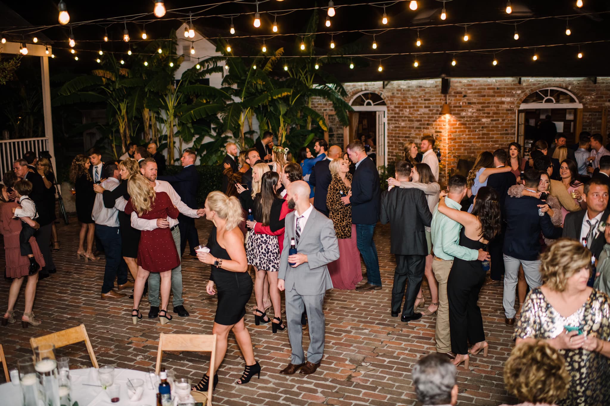 Guests enjoying a reception in the indoor venue at Cabin & Courtyard Events
